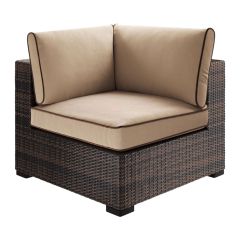 corner chair with tan cushions