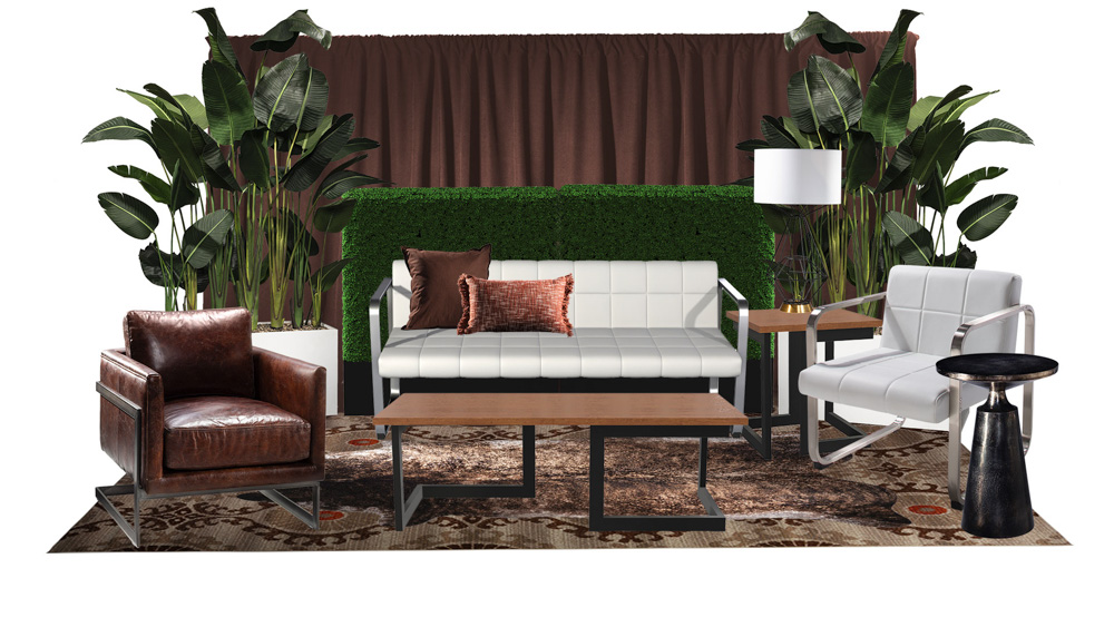 green soft seating set up with life like trees and orange accents